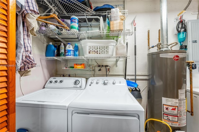 clothes washing area with separate washer and dryer, water heater, and electric panel