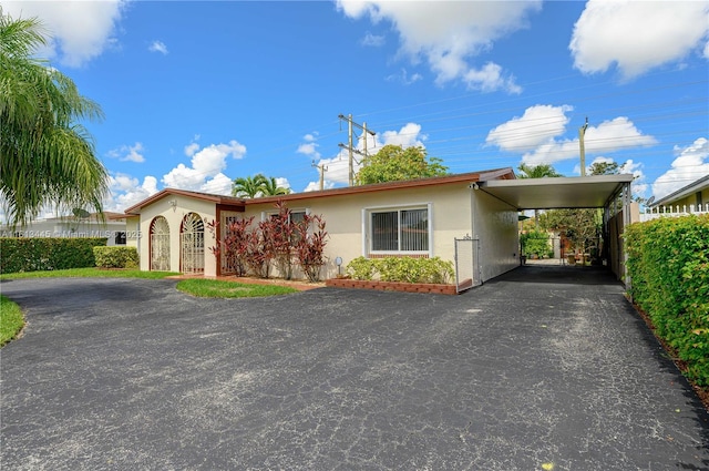 view of front of property with a carport