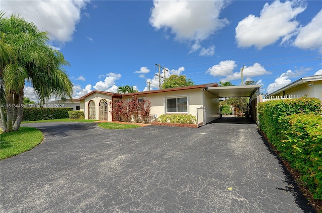 view of front facade with a carport