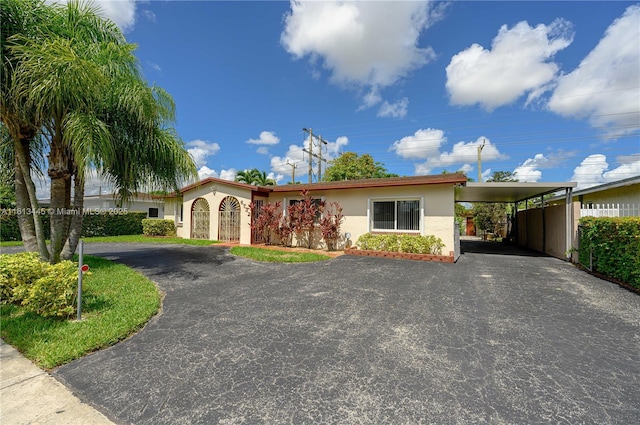 view of front of house featuring a carport