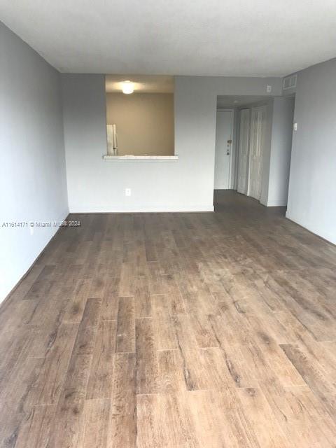 unfurnished room featuring wood-type flooring