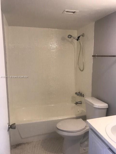 full bathroom with tile patterned flooring, vanity, washtub / shower combination, and toilet