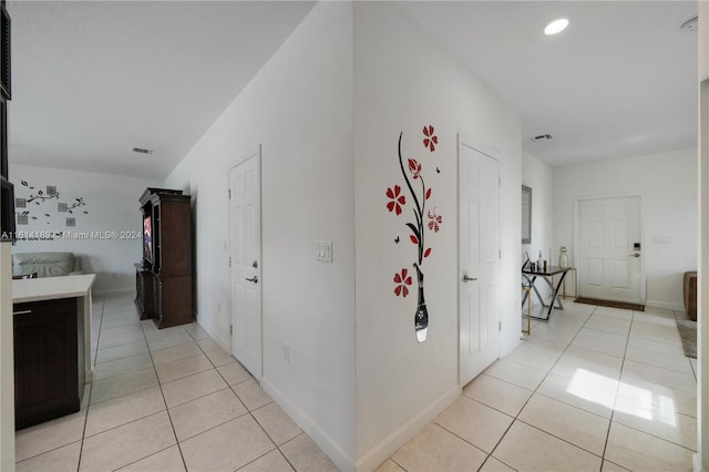 hallway with light tile patterned flooring