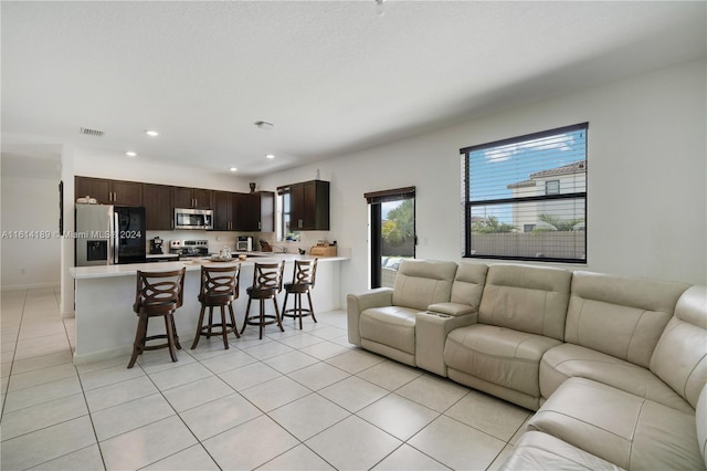 living room featuring light tile patterned flooring