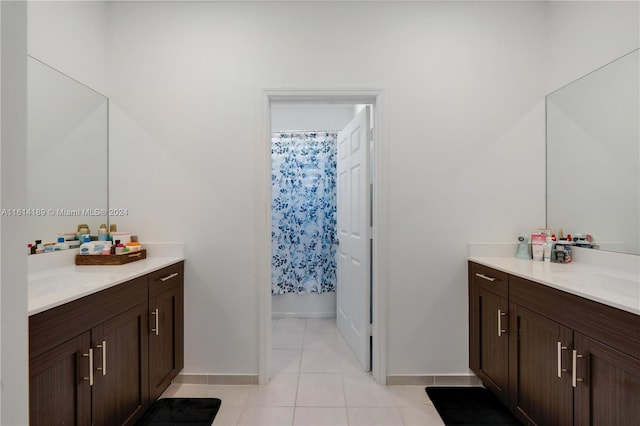 bathroom with tile patterned flooring and vanity