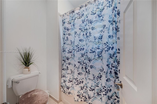 bathroom featuring tile patterned floors and toilet