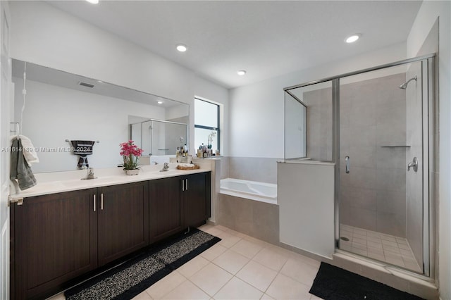 bathroom featuring separate shower and tub, tile patterned flooring, and dual bowl vanity