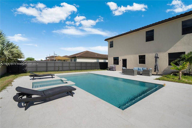 view of pool with an outdoor living space and a patio