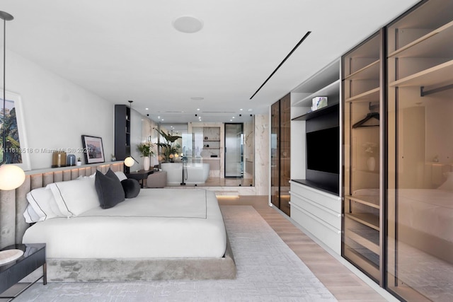 bedroom featuring light wood-type flooring