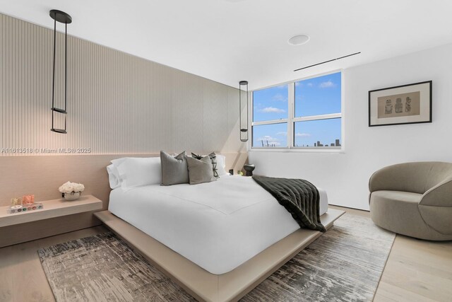 bedroom with wood-type flooring