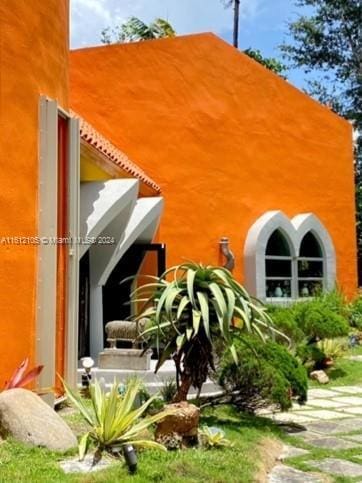 view of home's exterior with stucco siding