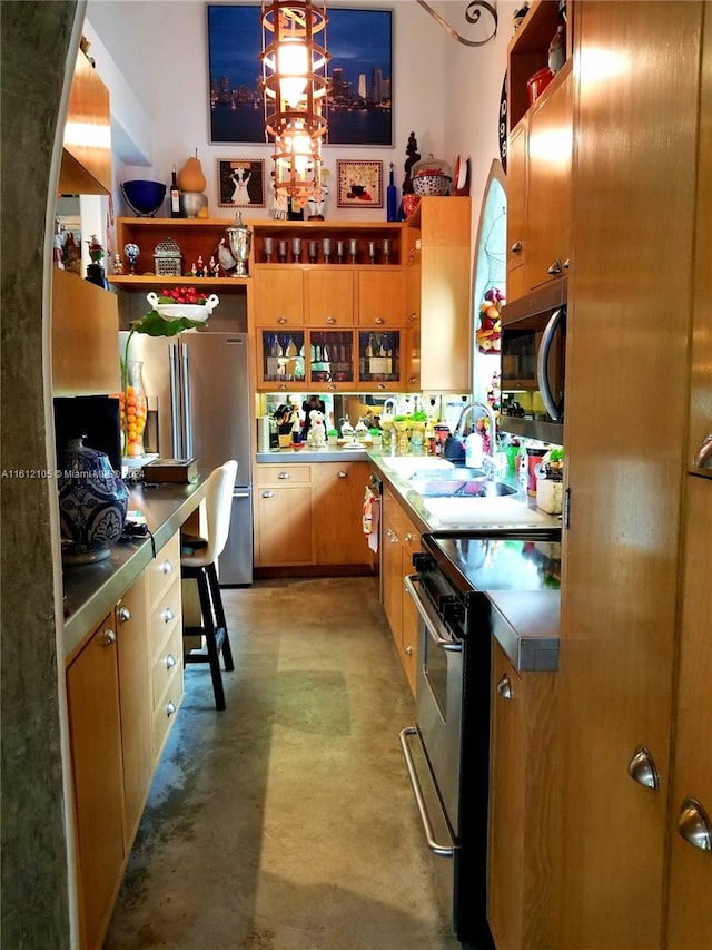 kitchen with appliances with stainless steel finishes, sink, and stainless steel counters