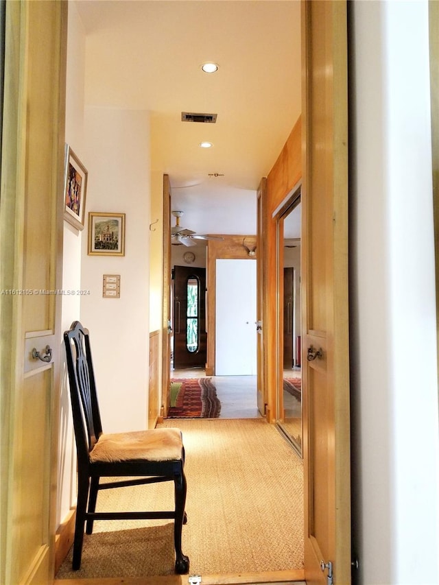 hallway with carpet flooring