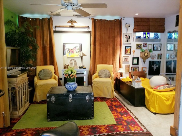interior space with ceiling fan