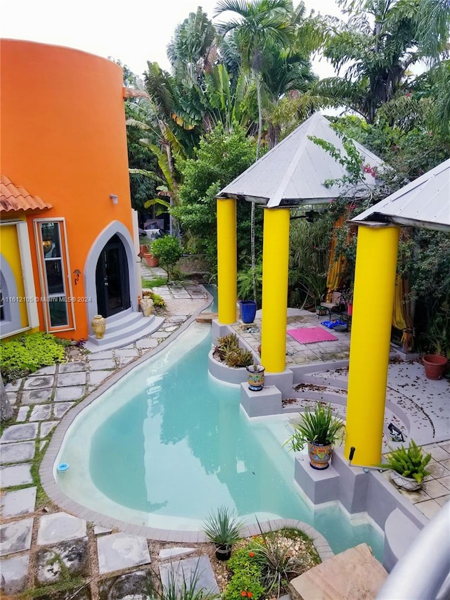 view of swimming pool featuring a patio