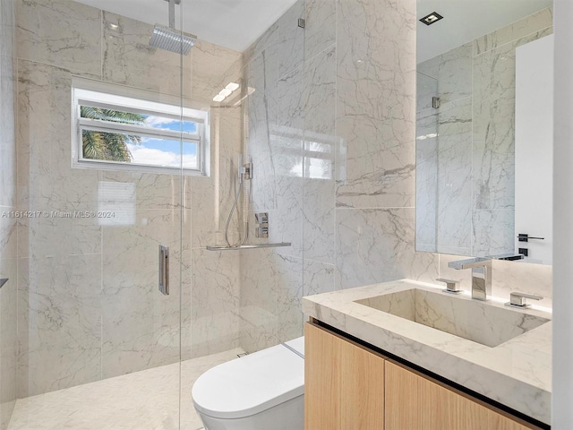 bathroom featuring vanity, a shower with shower door, and toilet