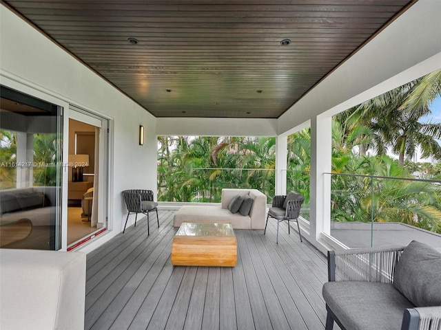 wooden terrace featuring outdoor lounge area