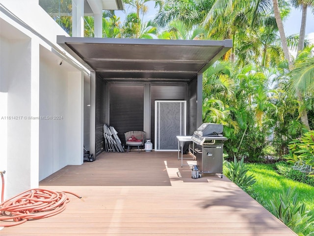 view of patio / terrace with a wooden deck and area for grilling