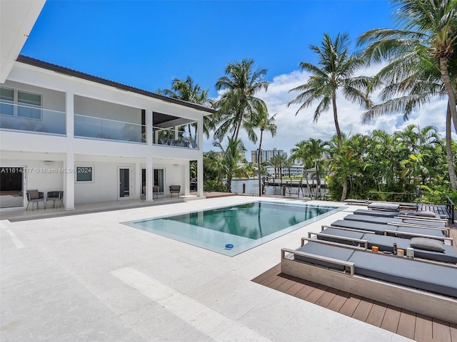 view of swimming pool featuring a patio area