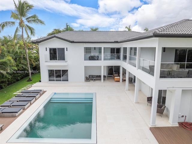 rear view of house featuring a patio area