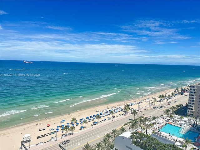 aerial view featuring a view of the beach and a water view