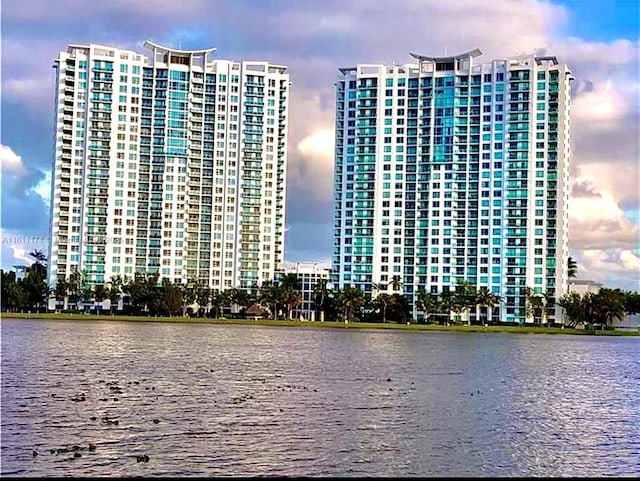 outdoor building at dusk featuring a water view