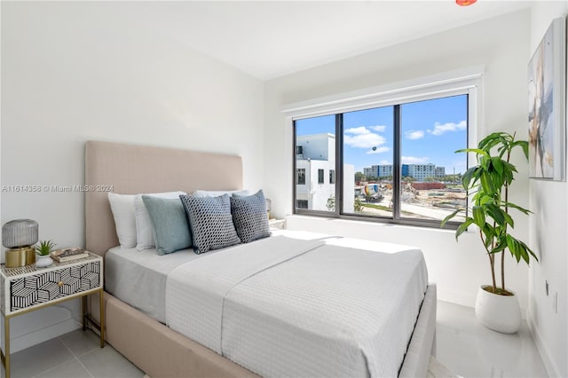 bedroom with light tile patterned floors