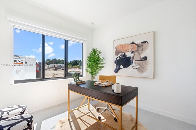 office area featuring concrete floors