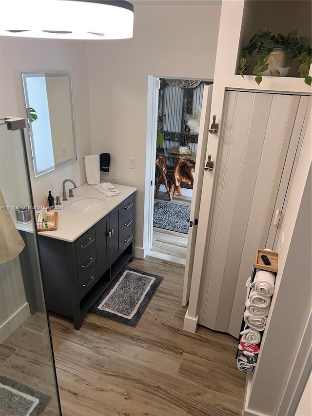 bathroom with vanity and hardwood / wood-style flooring