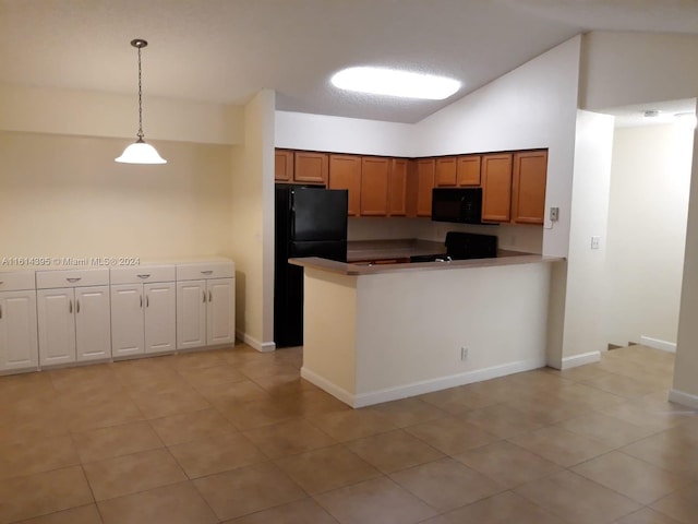 kitchen with lofted ceiling, pendant lighting, kitchen peninsula, and black appliances