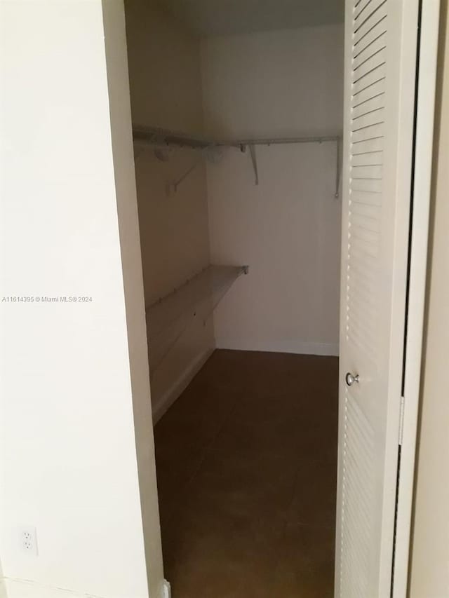 walk in closet featuring tile patterned floors