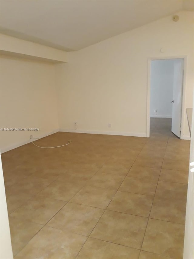 unfurnished room featuring light tile patterned floors