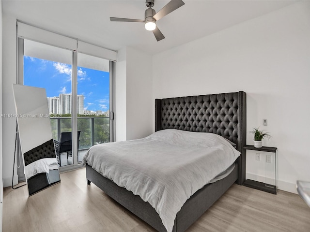 bedroom featuring ceiling fan and light hardwood / wood-style flooring