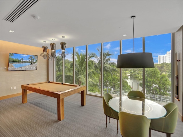 game room with pool table, expansive windows, and light carpet