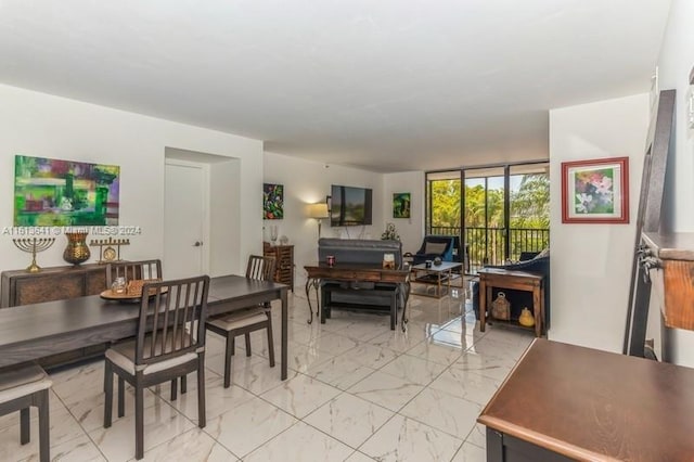 dining space with a wall of windows