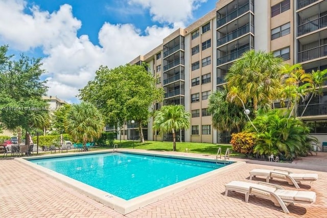 view of swimming pool featuring a patio area