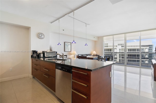 kitchen featuring rail lighting, stainless steel dishwasher, sink, light tile patterned floors, and a wall of windows