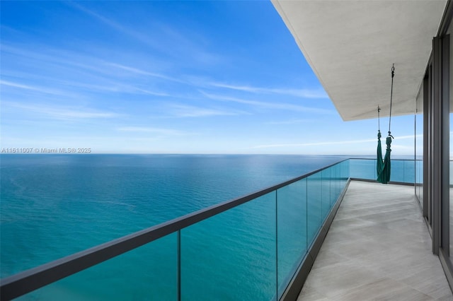 balcony featuring a water view