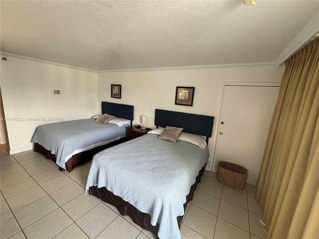 tiled bedroom featuring ornamental molding