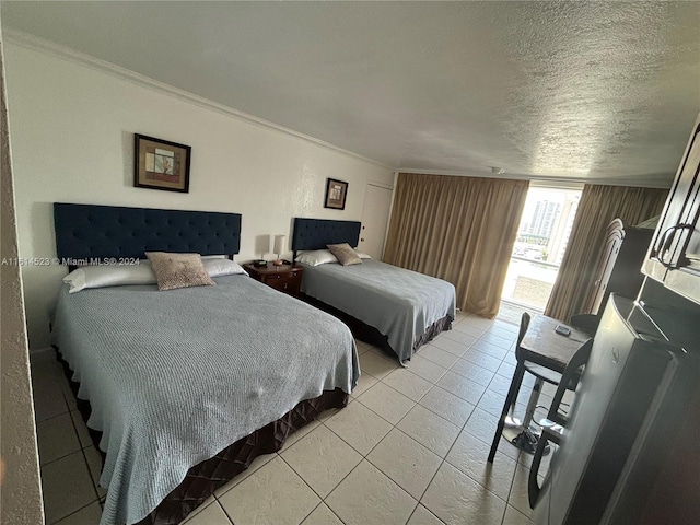 bedroom featuring a textured ceiling, light tile patterned floors, and crown molding