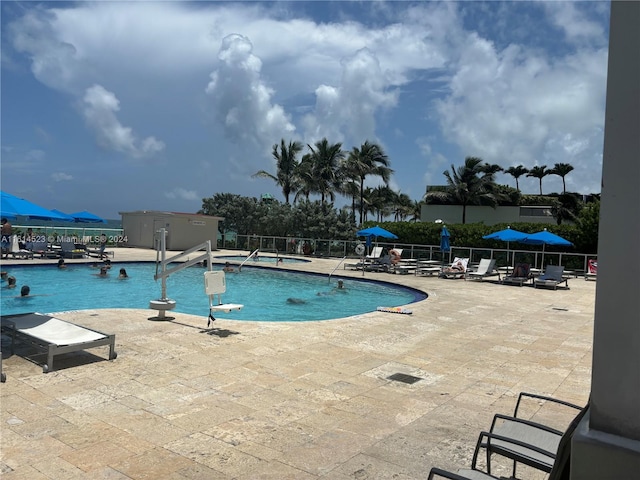 view of swimming pool with a patio