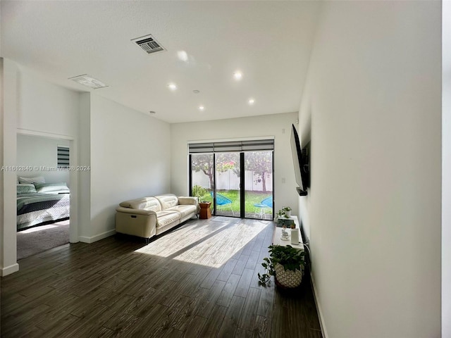 living room featuring dark hardwood / wood-style floors