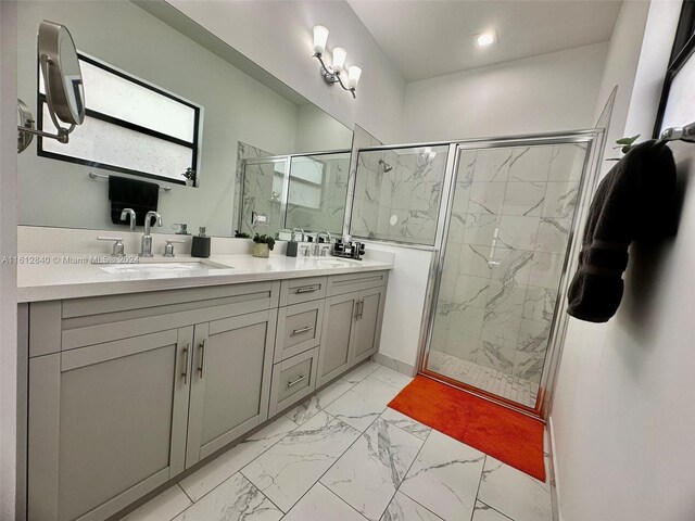 bathroom with an enclosed shower and vanity