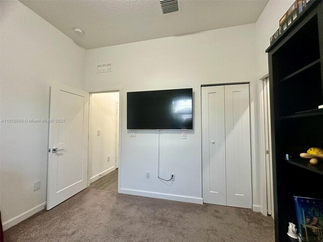 unfurnished bedroom featuring a closet and carpet