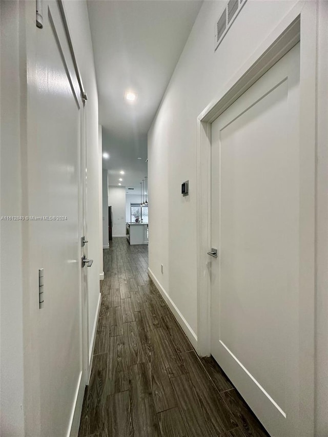 hallway featuring dark hardwood / wood-style floors