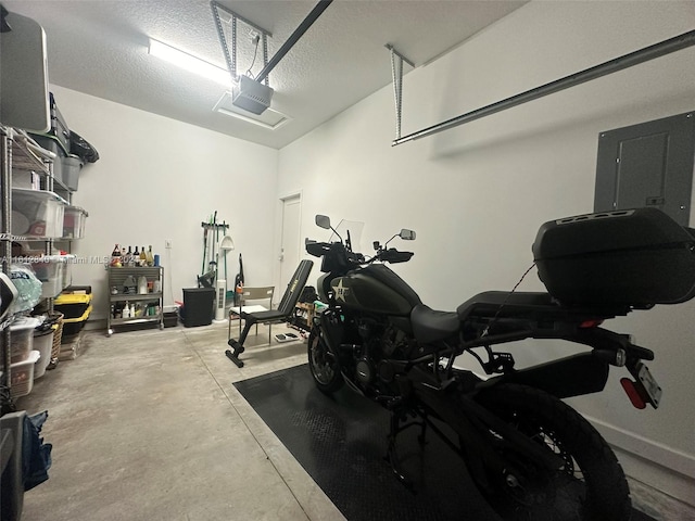 garage featuring a garage door opener and electric panel