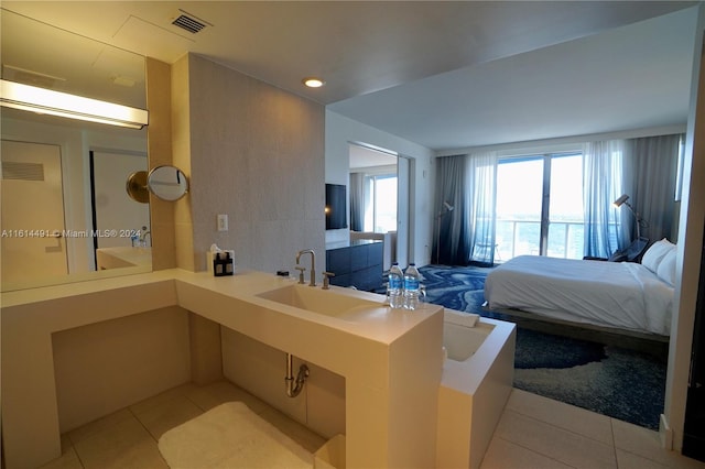 tiled bedroom with sink