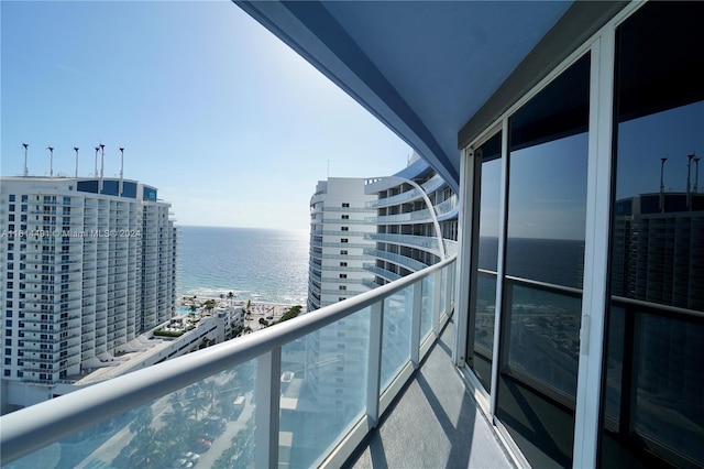 balcony featuring a water view