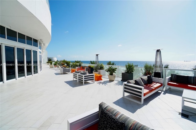 view of patio featuring outdoor lounge area and a water view