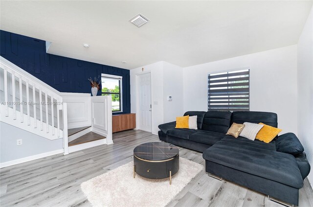 living room with light hardwood / wood-style flooring